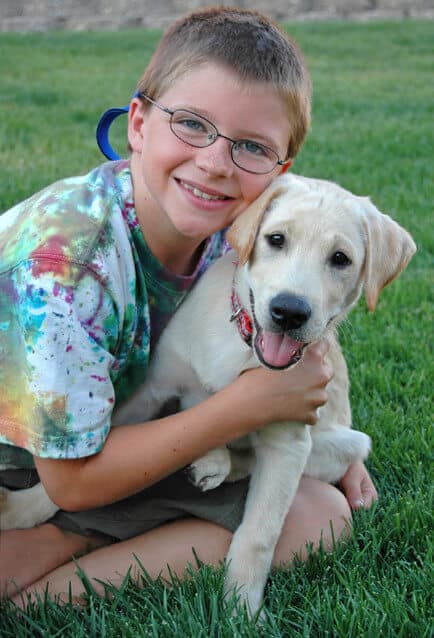 Kid with Labrador Retriever