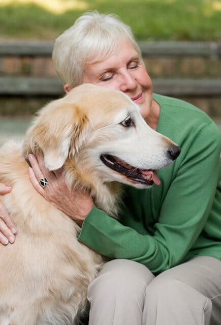 Senior Woman with senior golden retriever